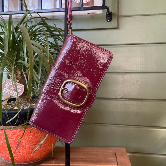 Coach Handbags - EUC Coach Bleecker Eggplant Patent Clutch, fits iPhone Pro Max Brass Hardware
